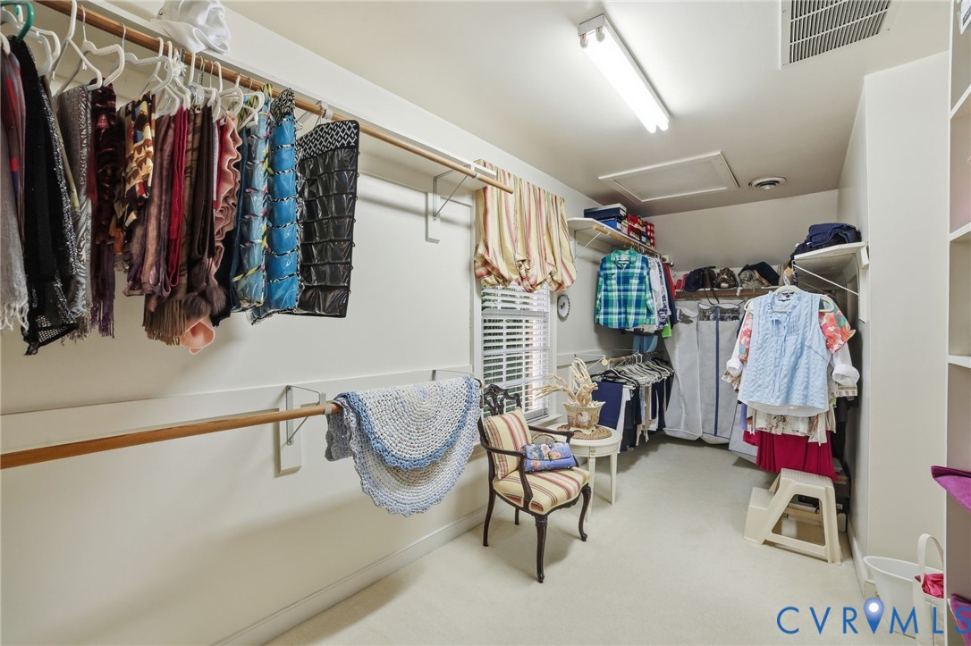 3950 Reeds Landing Circle Midlothian, VA 23113 - Photo 21 of 50 a view of walk in closet with clothes and shoes