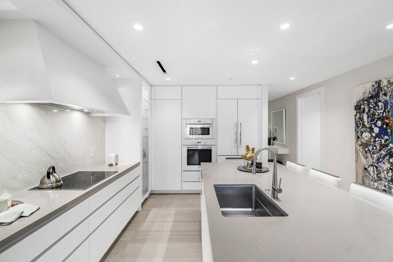 200 Southeast Mizner Boulevard, Unit 211 Boca Raton, FL 33432 - Photo 8 of 67 a kitchen with sink refrigerator and stove