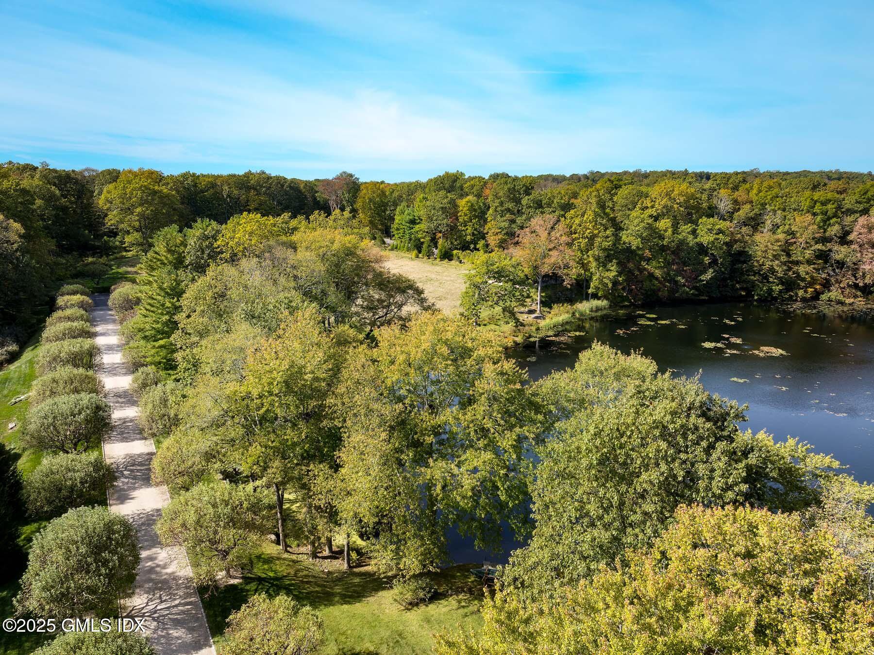 65 John Street Greenwich, CT 06831 - Photo 2 of 12 a view of a lake with a mountain in the background