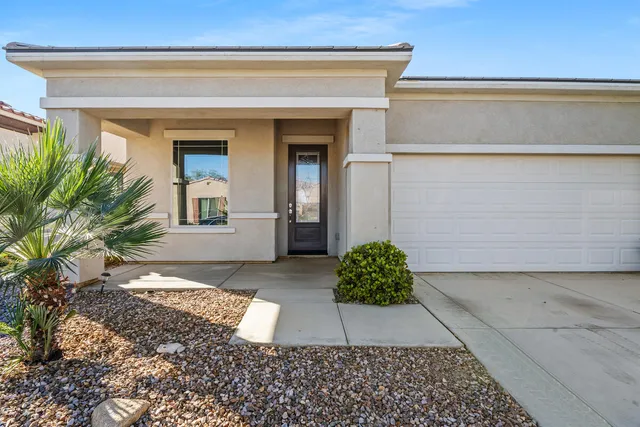 a view of a kitchen with furniture and a ceiling fan