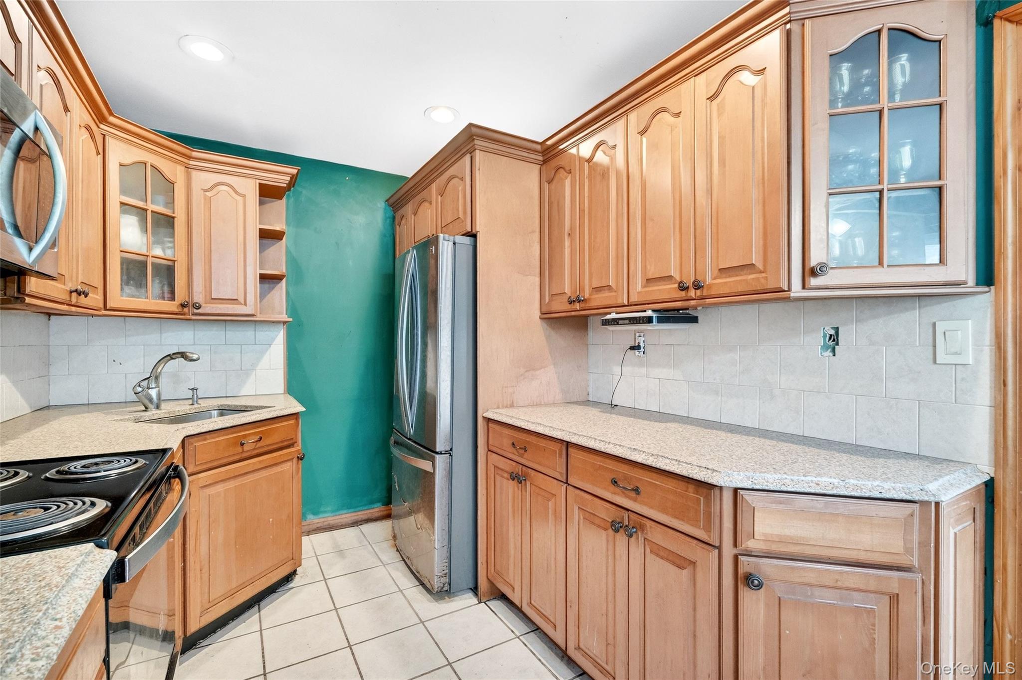 35 Maple Lane Monroe, NY 10950 - Photo 13 of 48 a kitchen with stainless steel appliances granite countertop a stove a sink and a refrigerator