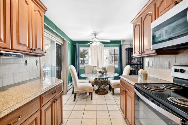 a kitchen with a stove a sink and a microwave
