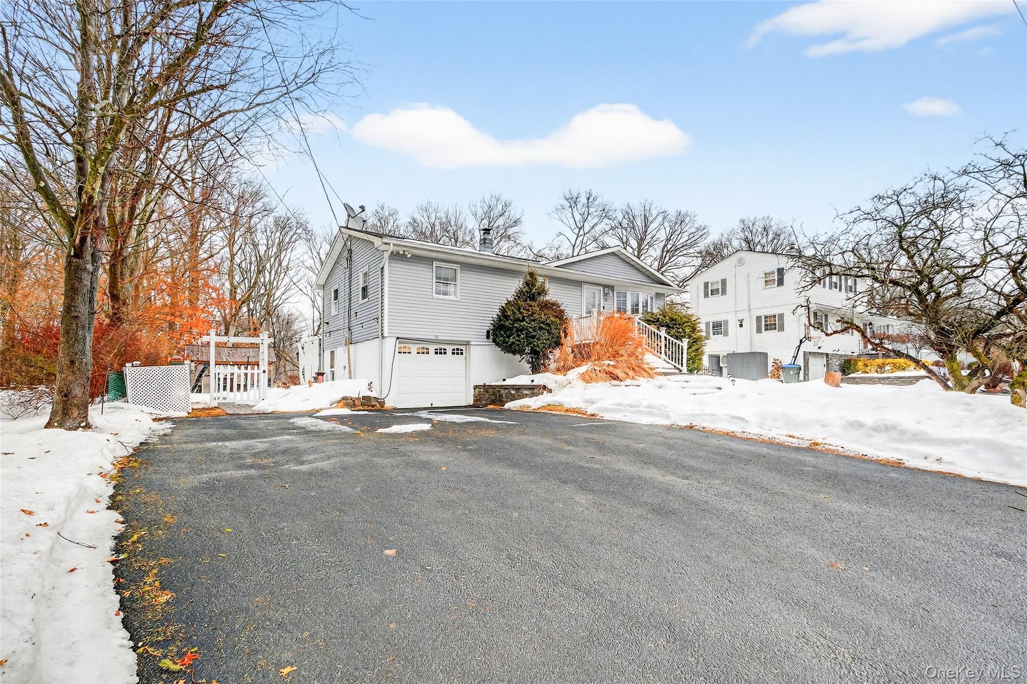 35 Maple Lane Monroe, NY 10950 - Photo 2 of 48 a view of a white house with a snow on the road
