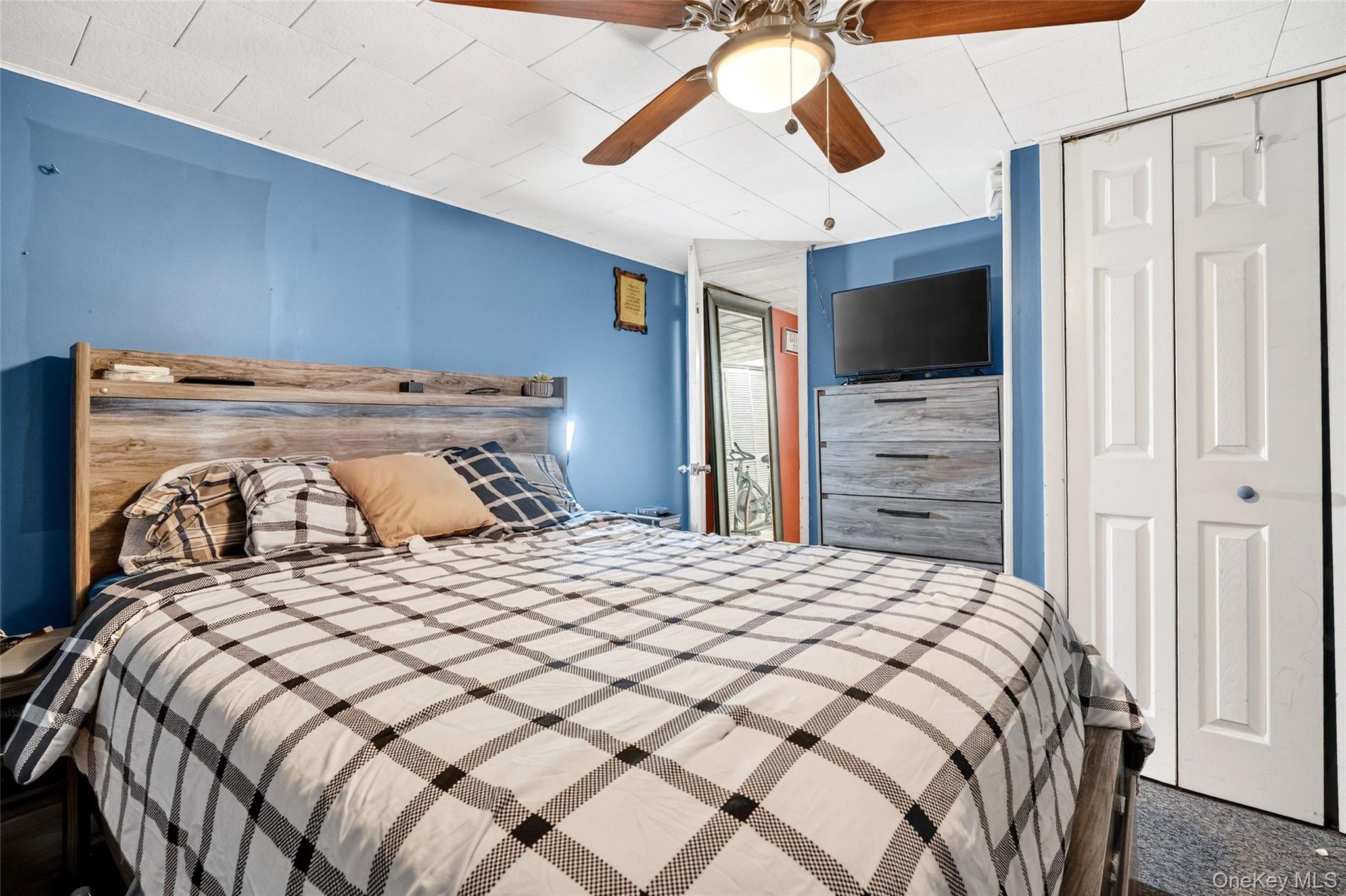 35 Maple Lane Monroe, NY 10950 - Photo 36 of 48 a bedroom with a bed and a flat screen tv