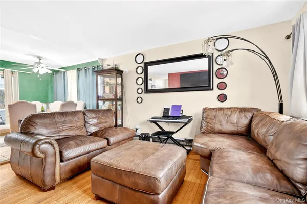 a living room with furniture and flat screen tv