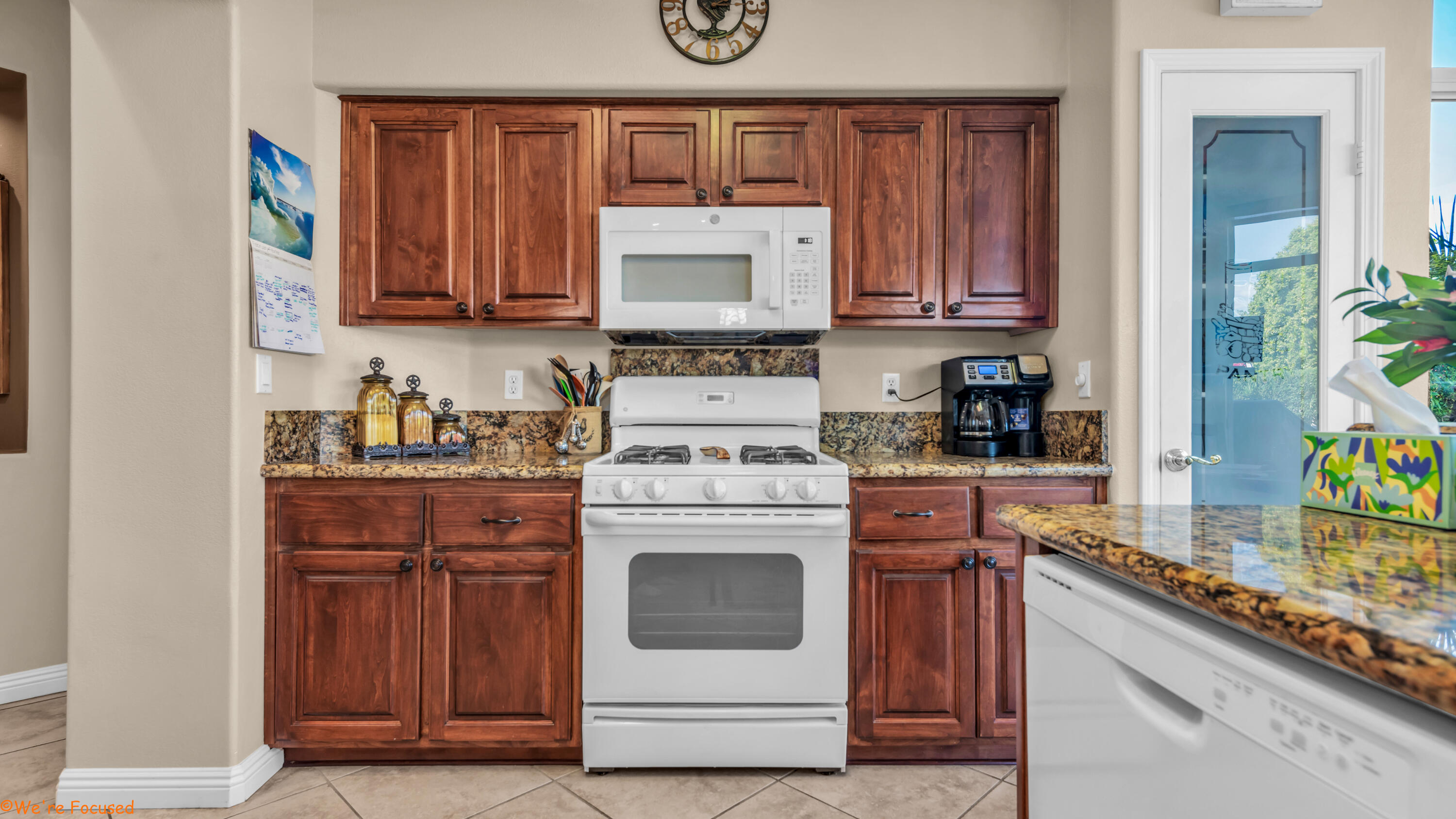 78326 Moongold Road Palm Desert, CA 92211 - Photo 11 of 33 a kitchen with stainless steel appliances granite countertop a stove and a refrigerator