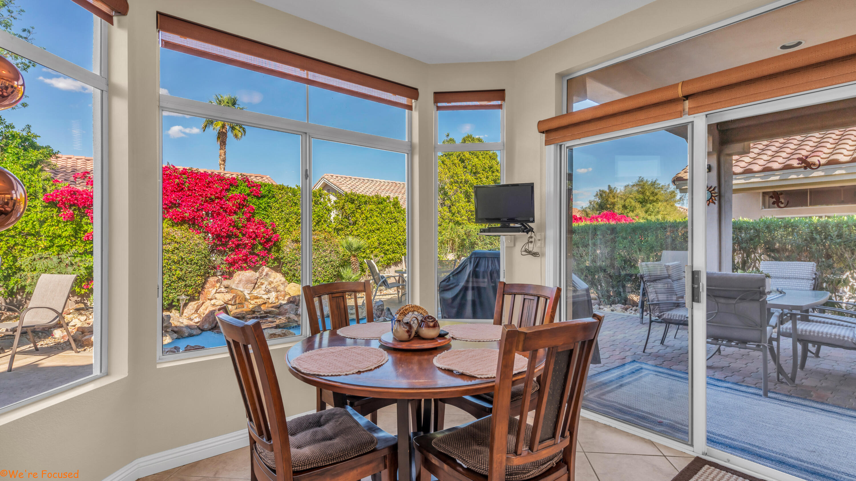 78326 Moongold Road Palm Desert, CA 92211 - Photo 13 of 33 a view of a dining room with furniture window and outside view