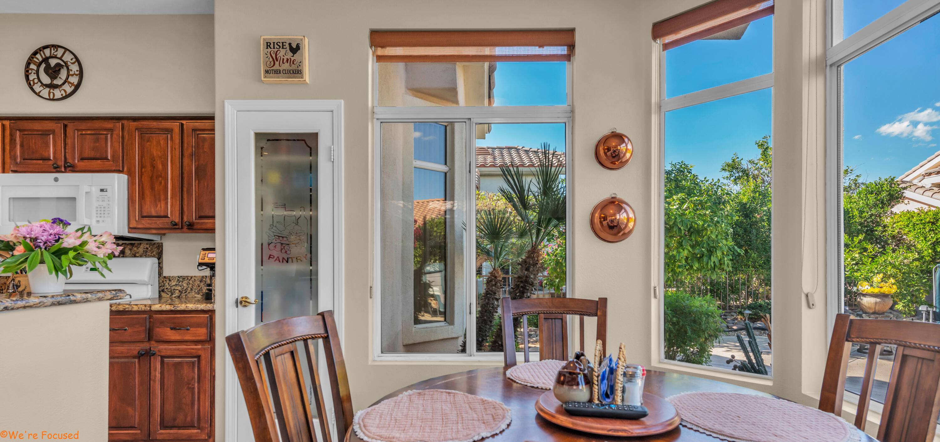 78326 Moongold Road Palm Desert, CA 92211 - Photo 14 of 33 a view of an entryway with wooden floor and windows