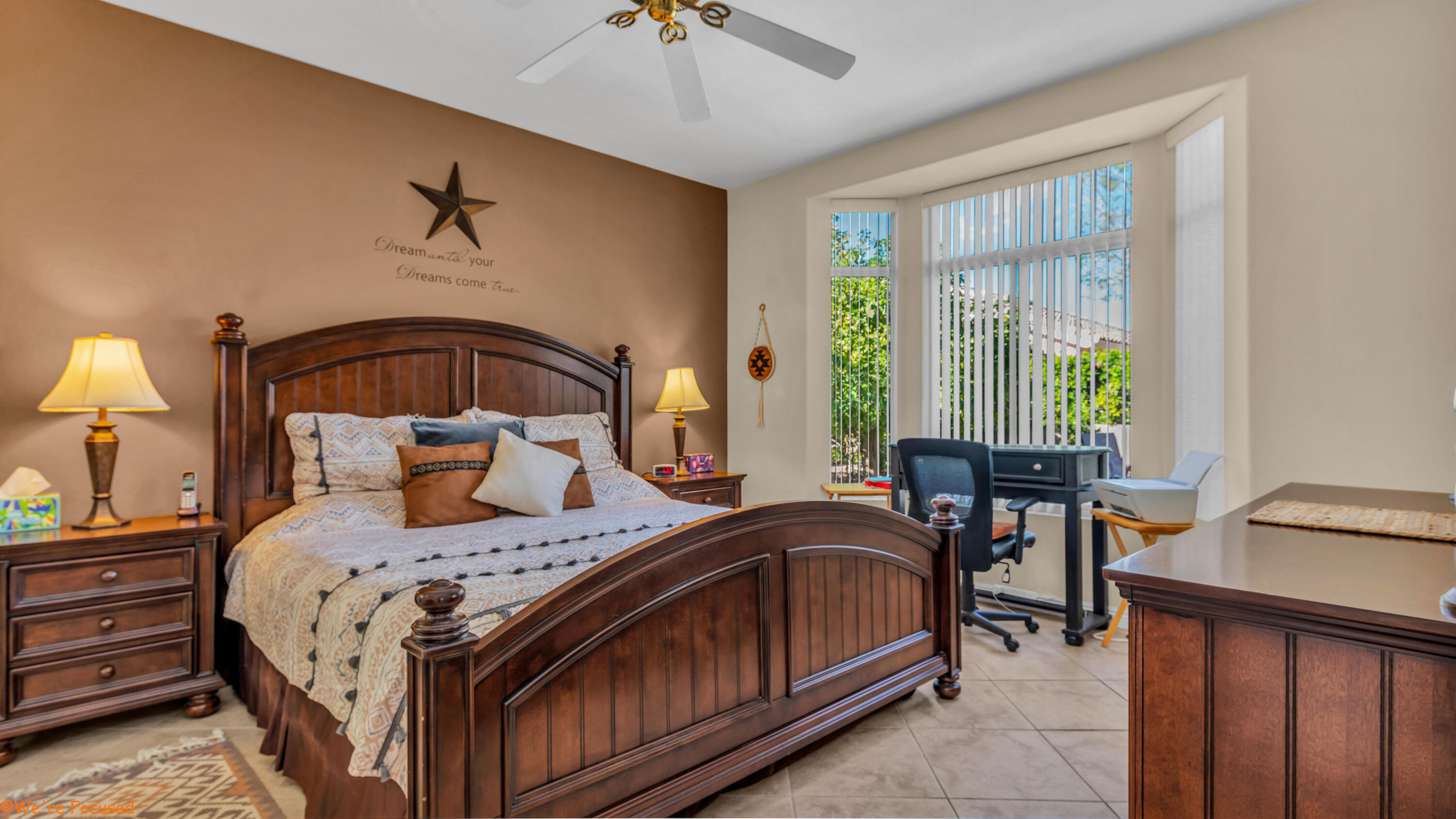 78326 Moongold Road Palm Desert, CA 92211 - Photo 16 of 33 a bedroom with a bed a table and chair