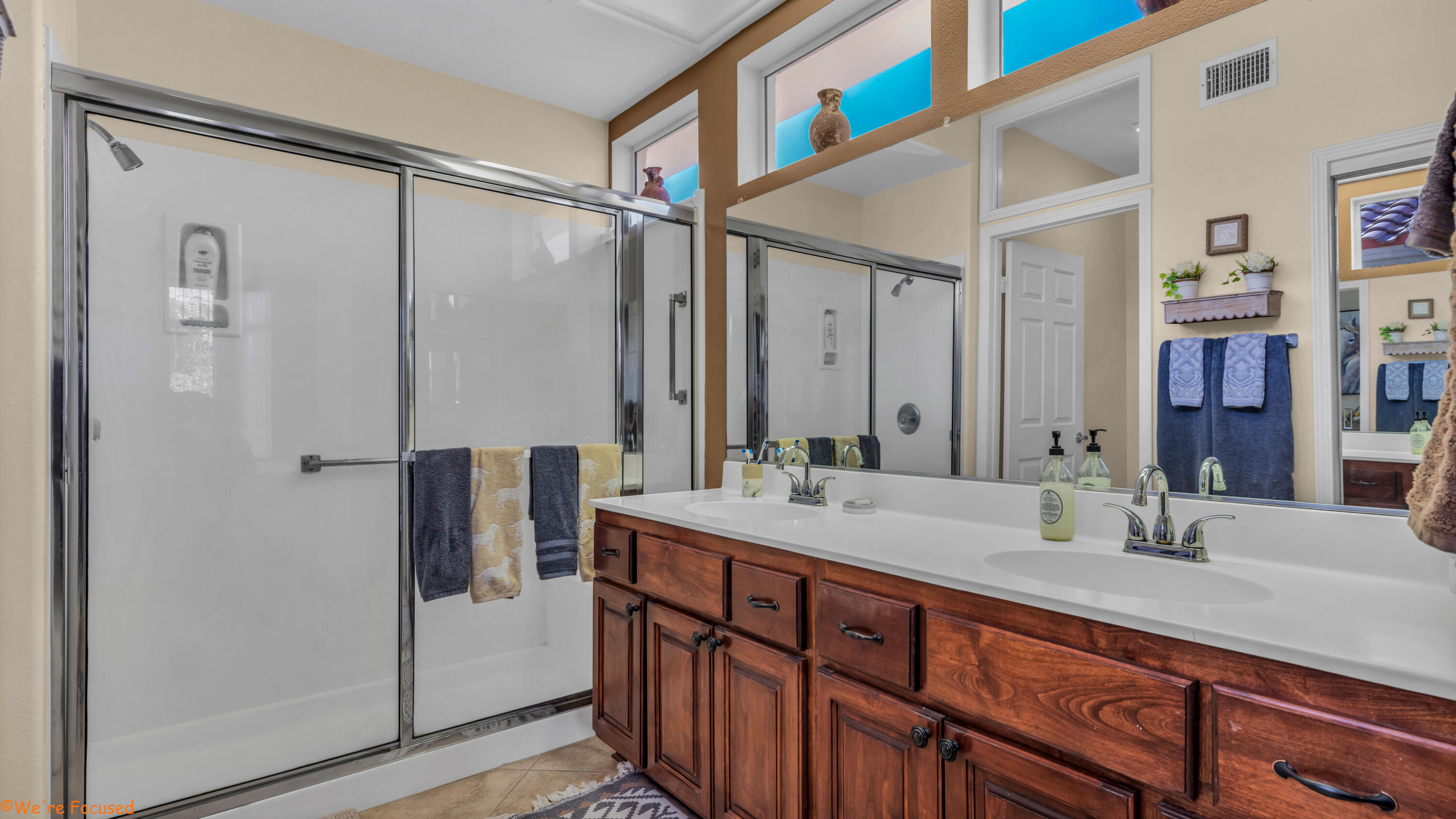78326 Moongold Road Palm Desert, CA 92211 - Photo 19 of 33 a bathroom with a double vanity sink and a mirror
