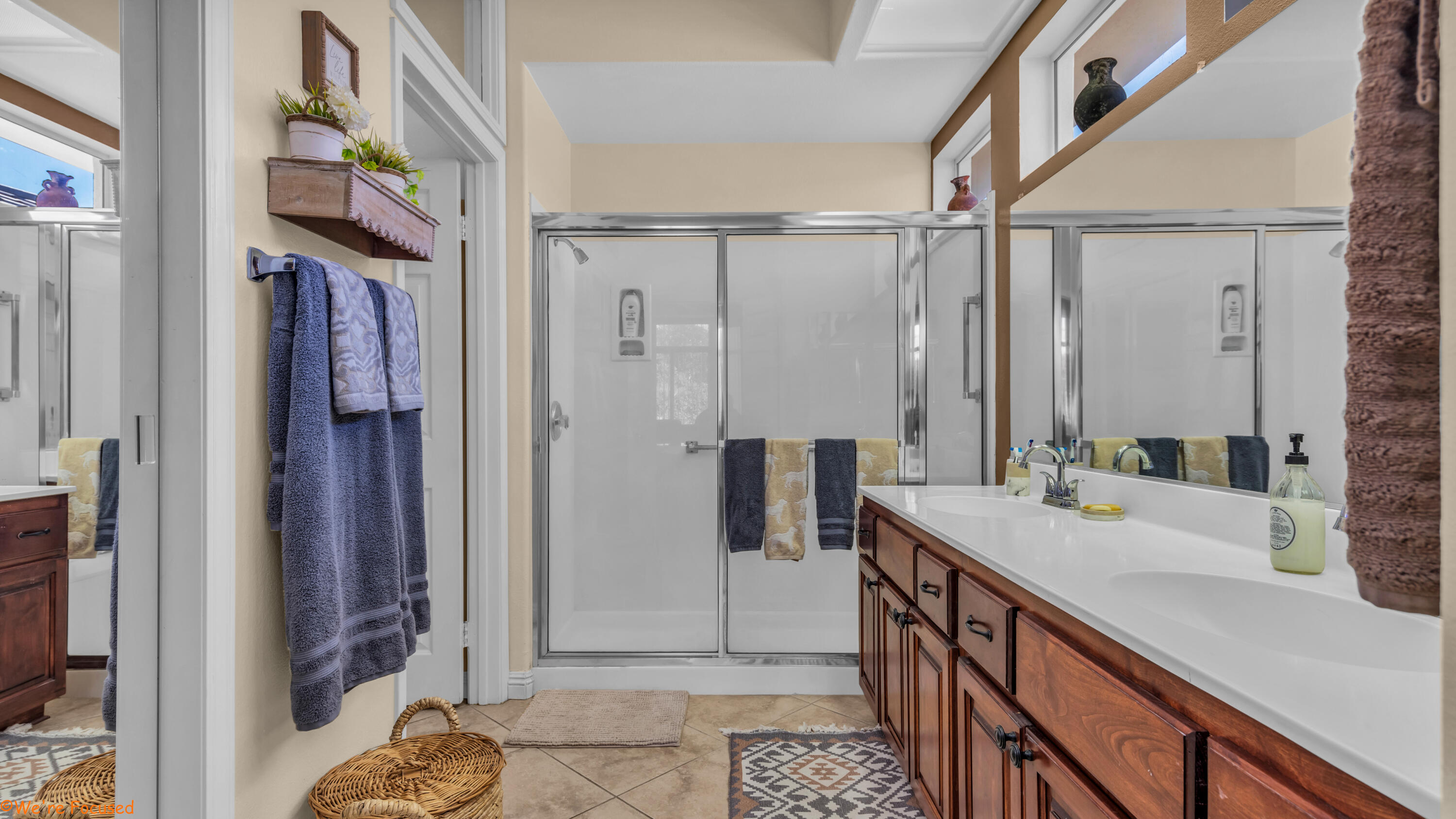 78326 Moongold Road Palm Desert, CA 92211 - Photo 20 of 33 a bathroom with a sink a mirror and a shower