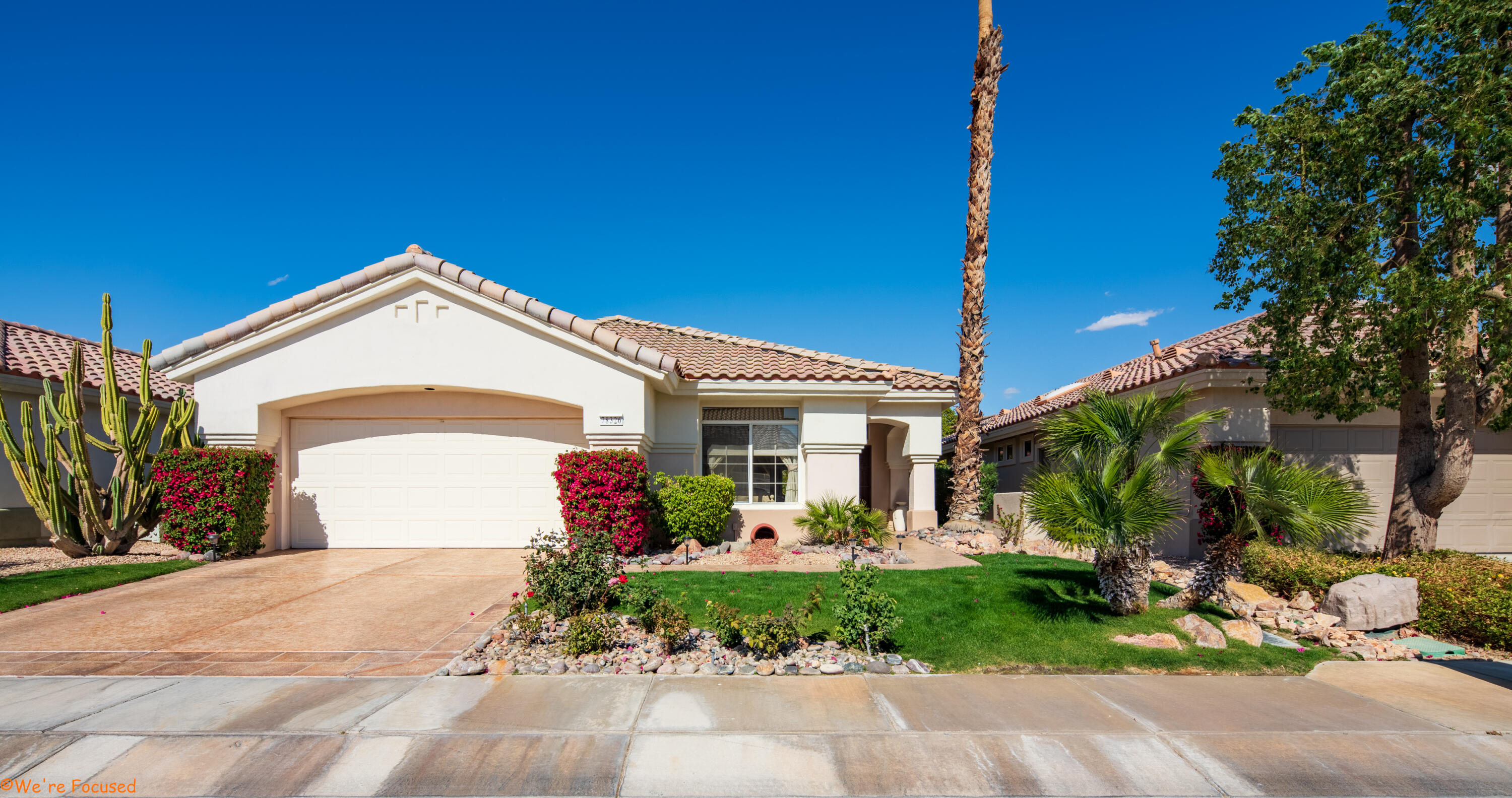 78326 Moongold Road Palm Desert, CA 92211 - Photo 2 of 33 a front view of a house with garden