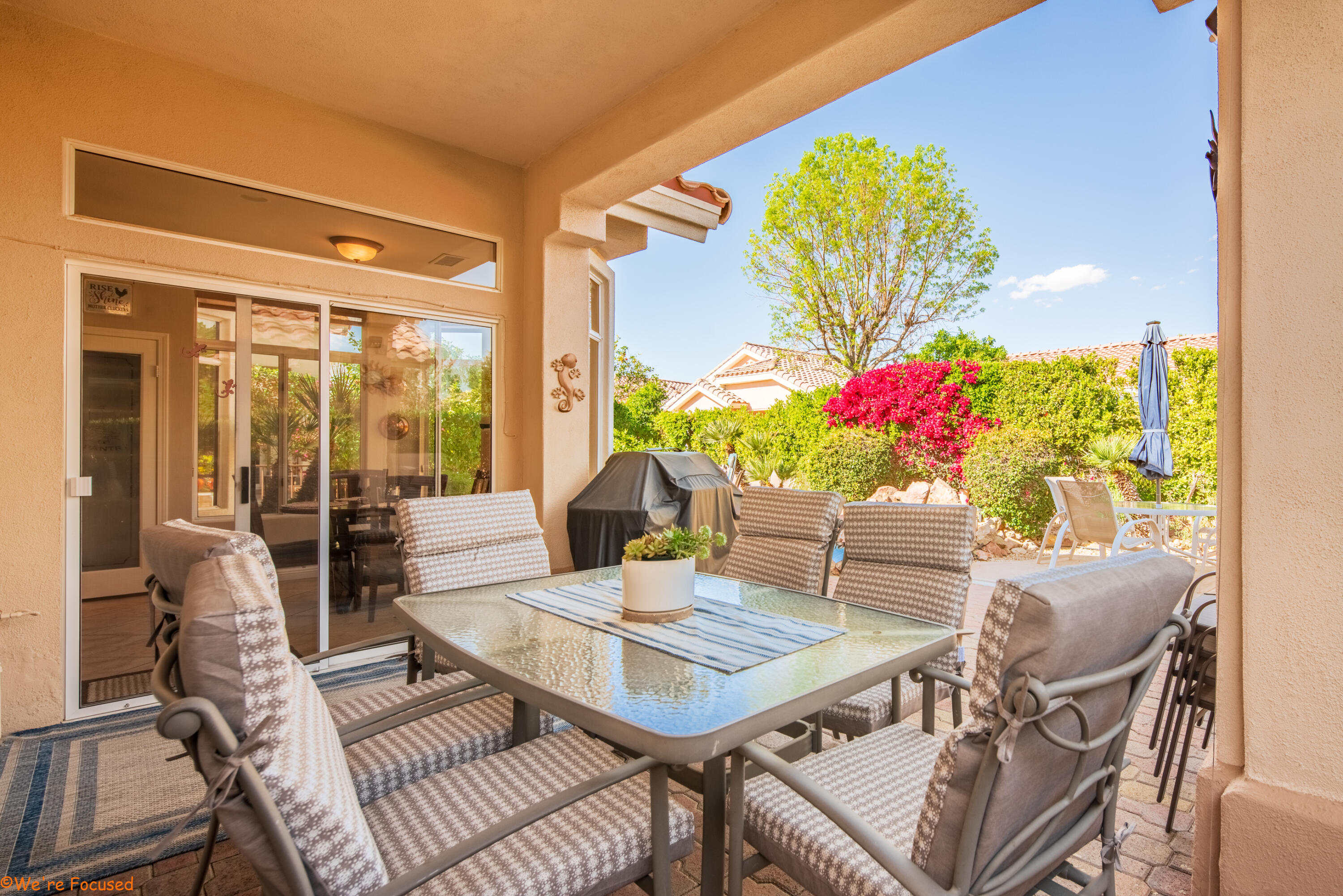 78326 Moongold Road Palm Desert, CA 92211 - Photo 25 of 33 a view of a dining room with furniture window and wooden floor