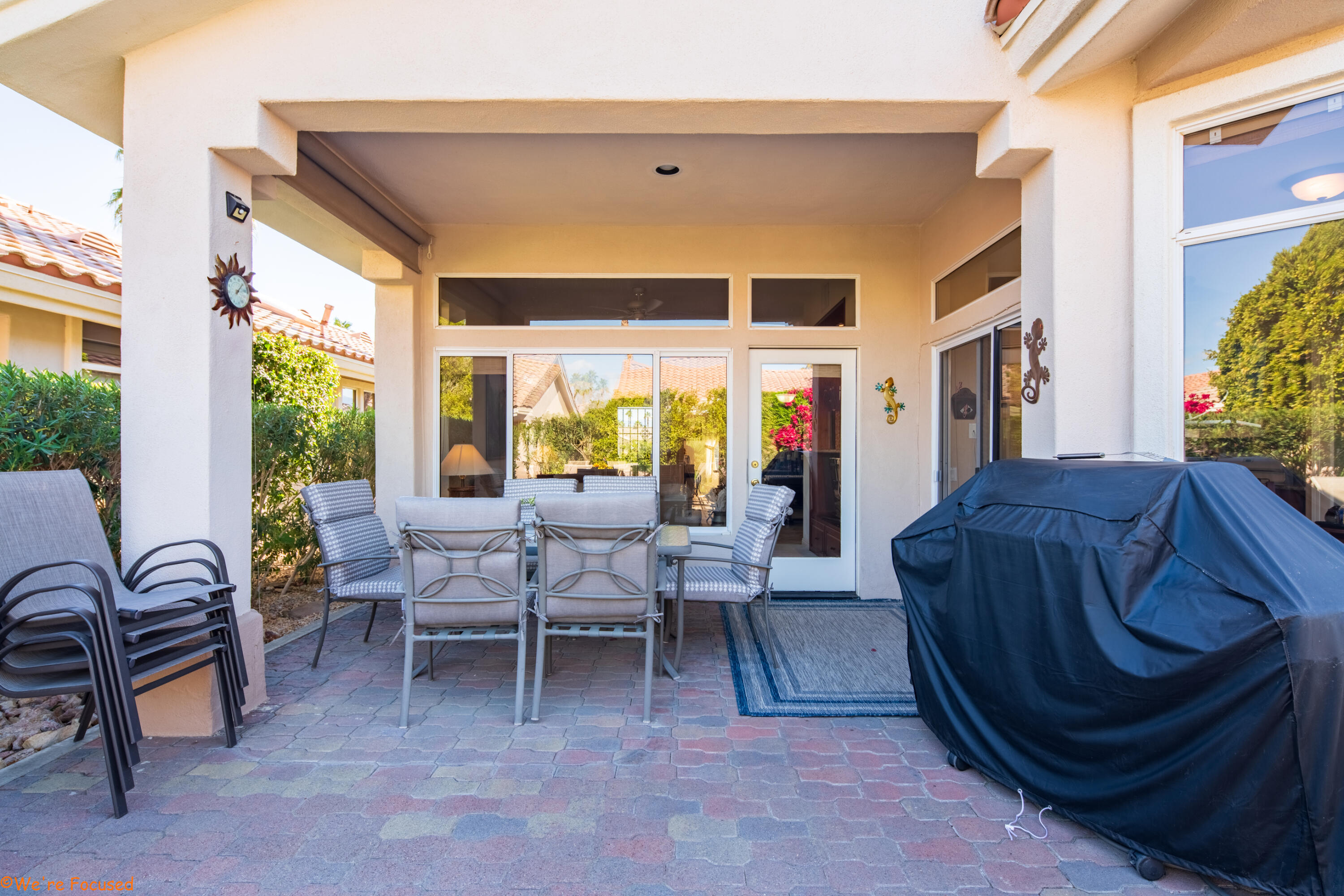 78326 Moongold Road Palm Desert, CA 92211 - Photo 27 of 33 a living room with furniture and a window