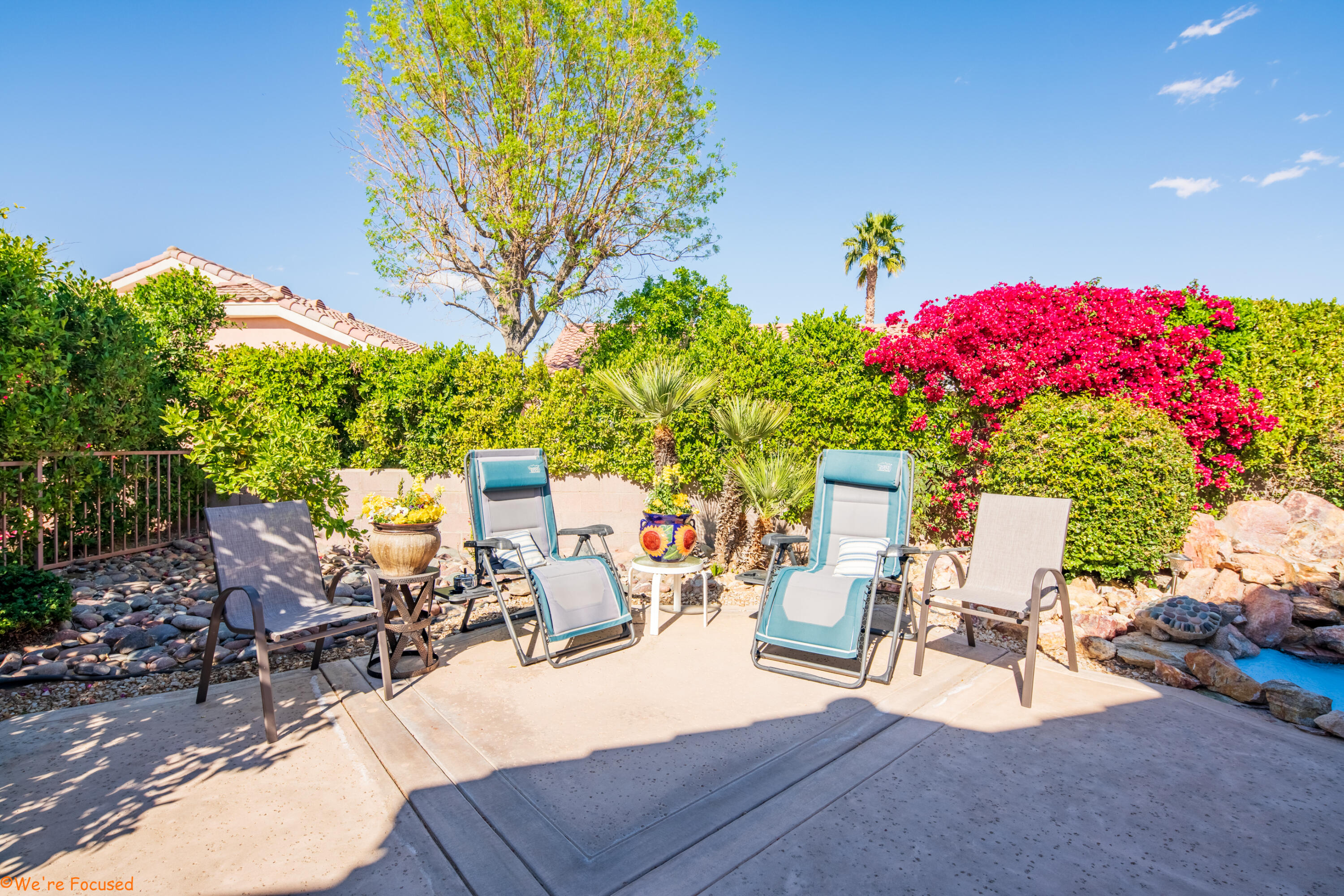 78326 Moongold Road Palm Desert, CA 92211 - Photo 31 of 33 a view of a patio with table and chairs and potted plants