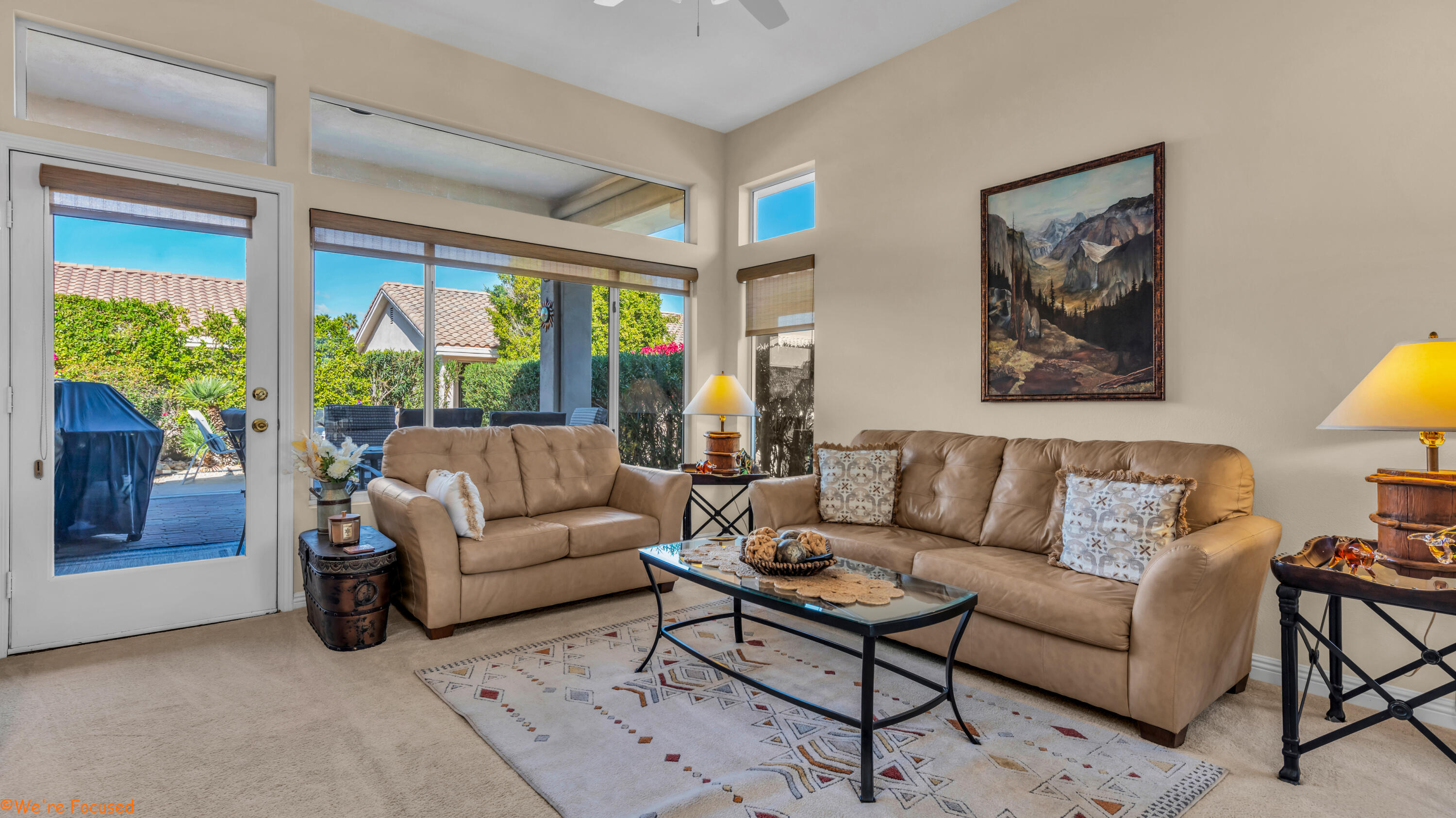 78326 Moongold Road Palm Desert, CA 92211 - Photo 5 of 33 a living room with furniture and a large window