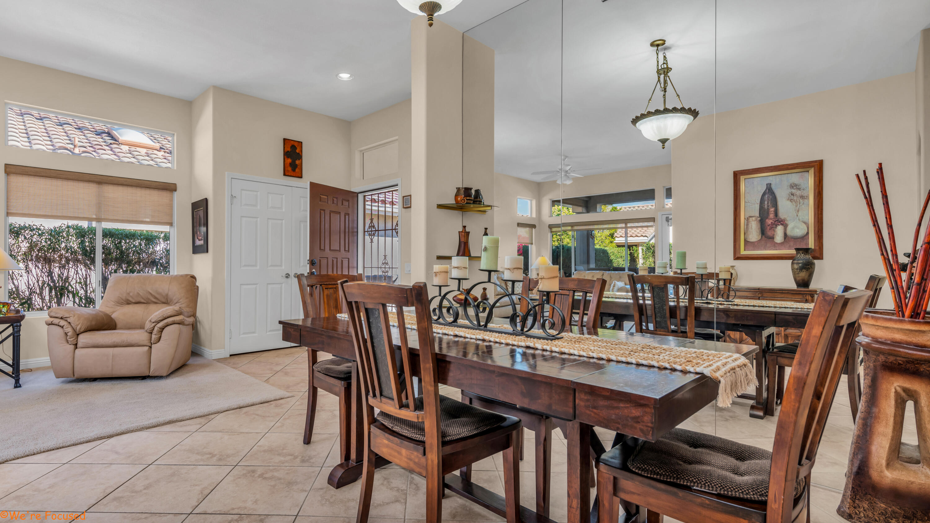 78326 Moongold Road Palm Desert, CA 92211 - Photo 7 of 33 a view of a dining room with furniture and a chandelier