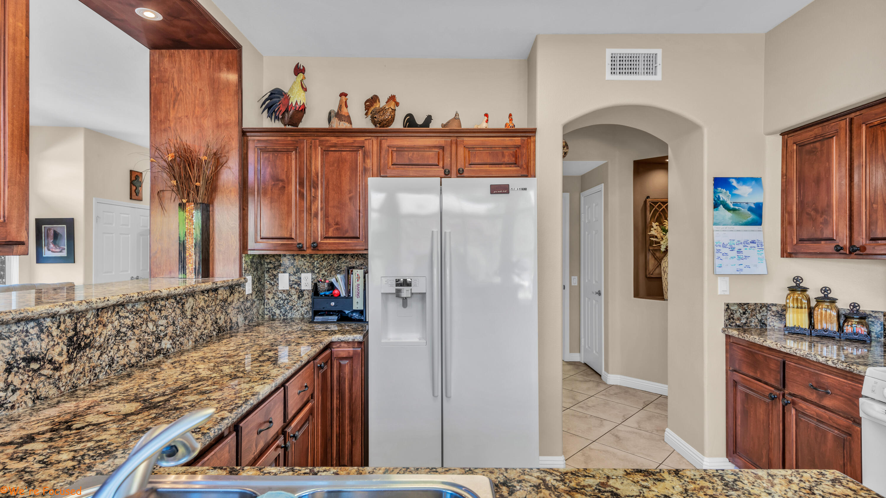78326 Moongold Road Palm Desert, CA 92211 - Photo 9 of 33 a kitchen with stainless steel appliances granite countertop a refrigerator and a stove top oven