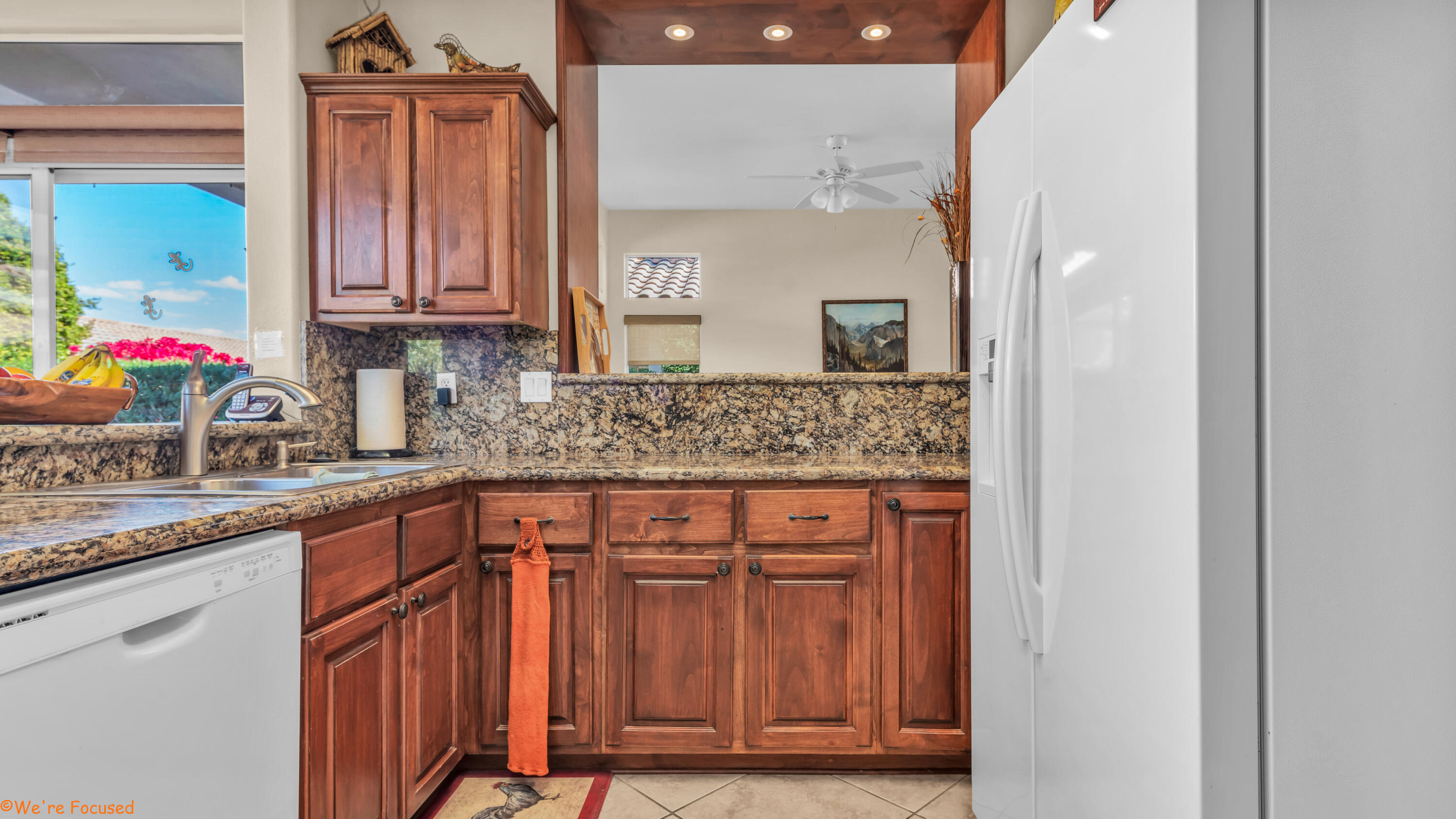 78326 Moongold Road Palm Desert, CA 92211 - Photo 10 of 33 a kitchen with stainless steel appliances granite countertop a sink and cabinets