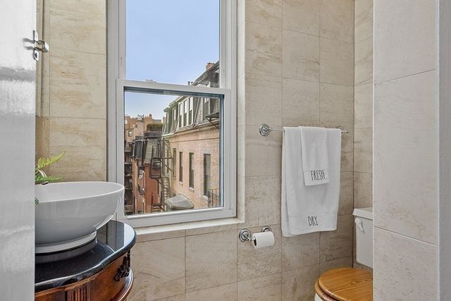 a bathroom with a tub and a shower