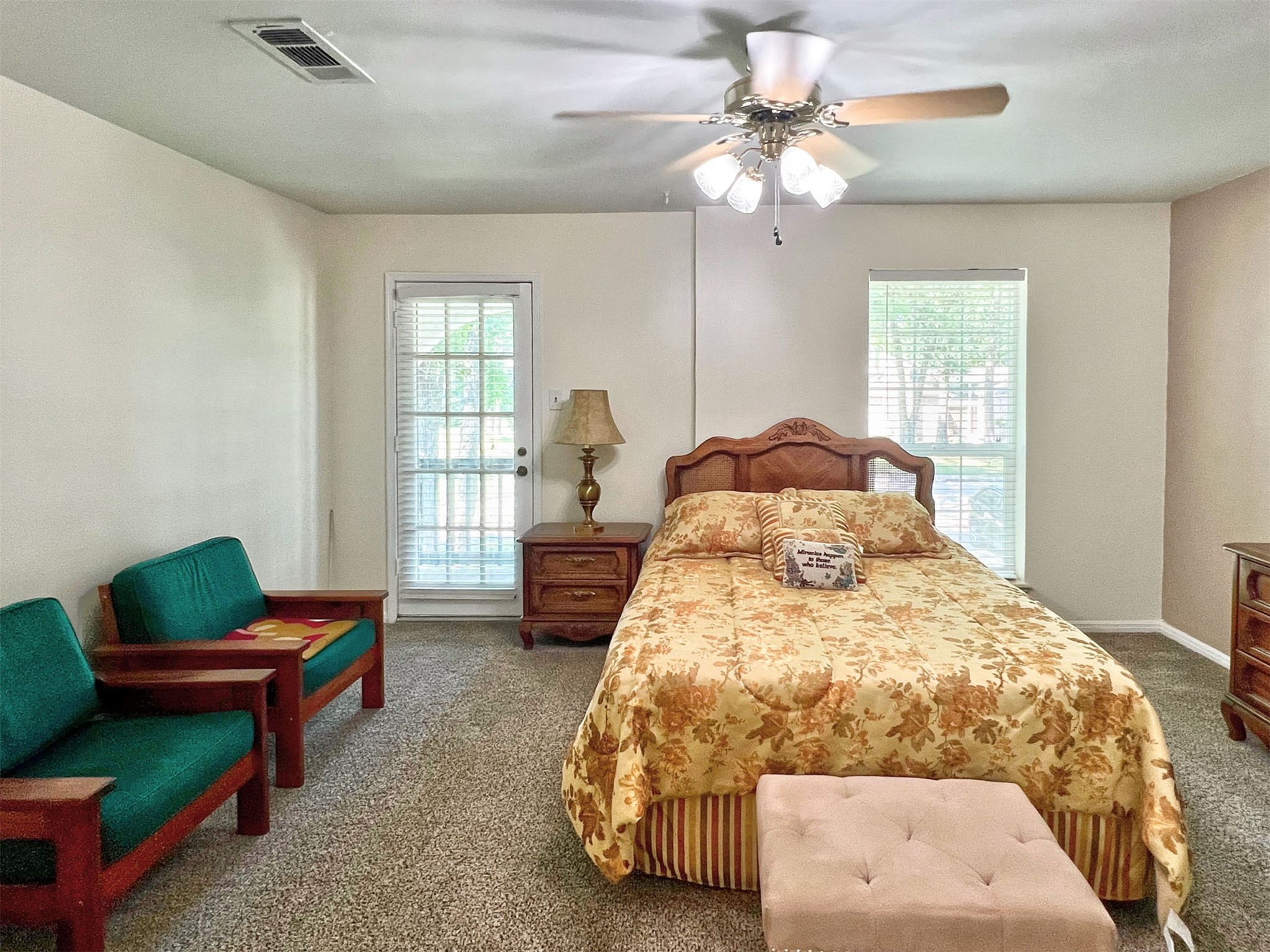 16902 Summit Oaks Lane Spring, TX 77379 - Photo 27 of 49 a bedroom with a bed a couch and a window