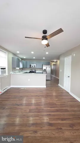 a view of a kitchen with a sink and a large mirror