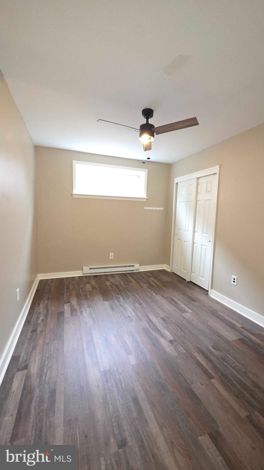 7330 Montour Street, Unit 1 Philadelphia, PA 19111 - Photo 7 of 8 wooden floor in an empty room with a window