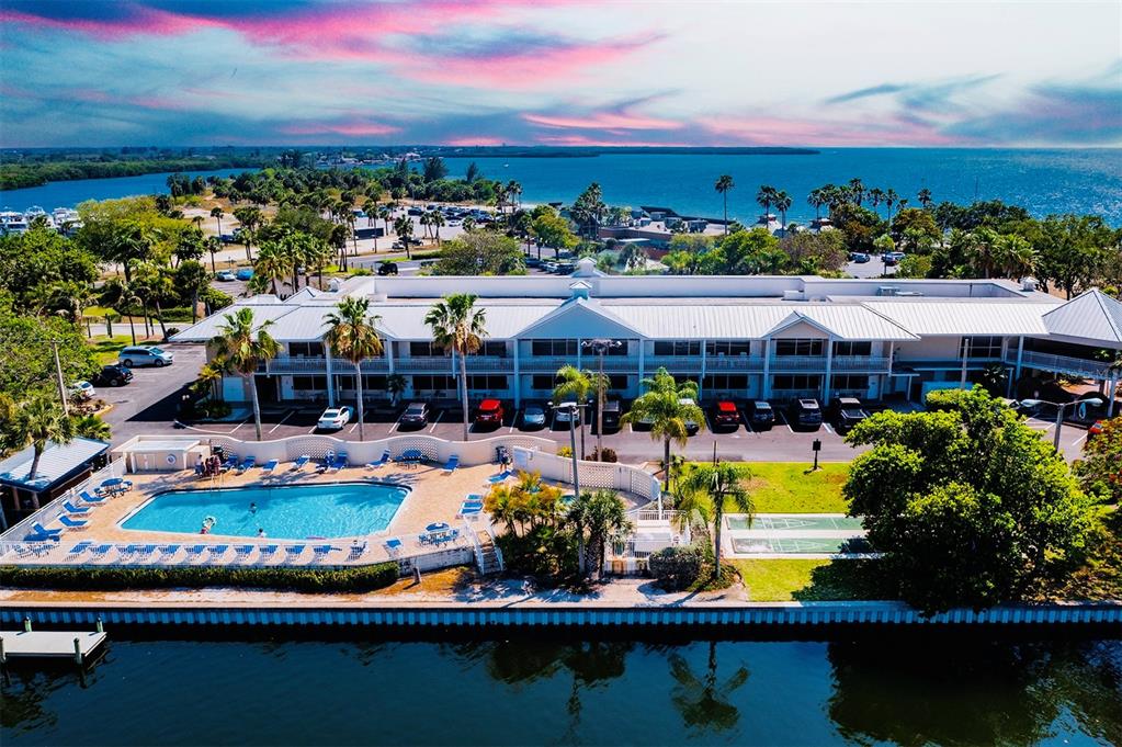 a view of a swimming pool with outdoor seating