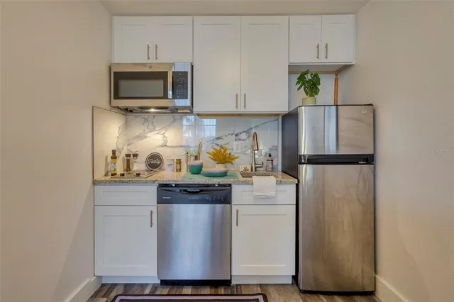 a bedroom with a bed and a flat screen television