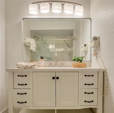 a bathroom with a bathtub and shower