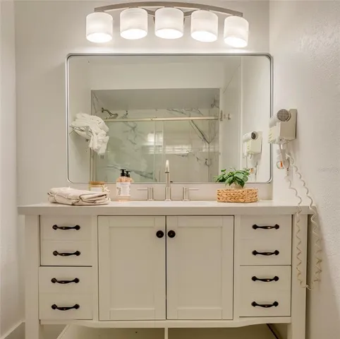 a bathroom with a bathtub and shower