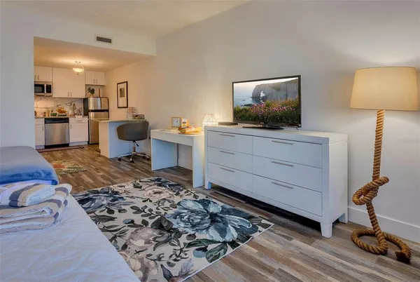 a bathroom with a sink vanity granite and toilet
