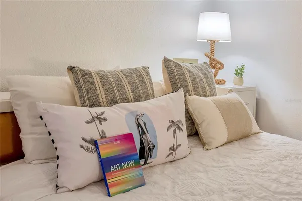 a bedroom with a bed and couch