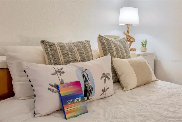 a bedroom with a bed and couch