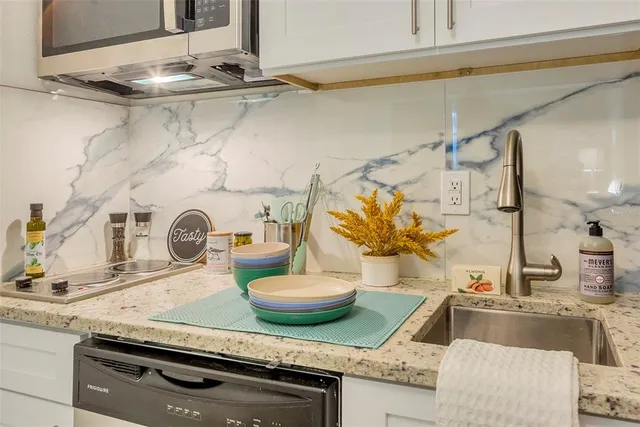 a kitchen with a stove and cabinets