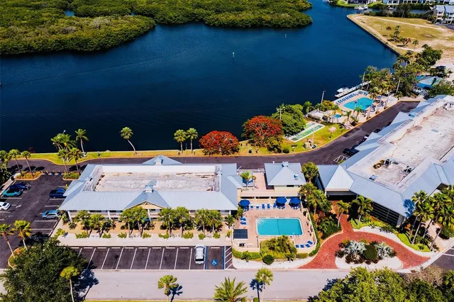 a bedroom with bed and a wooden floor