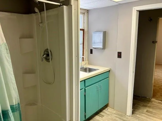 an empty room with closet and windows