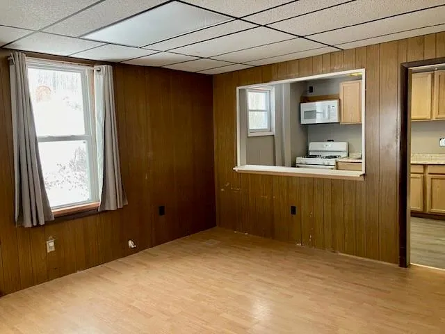 a view of a door with wooden floor and stairs