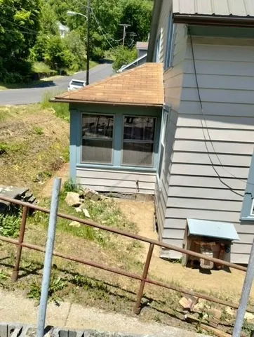 a view of balcony with wooden floor