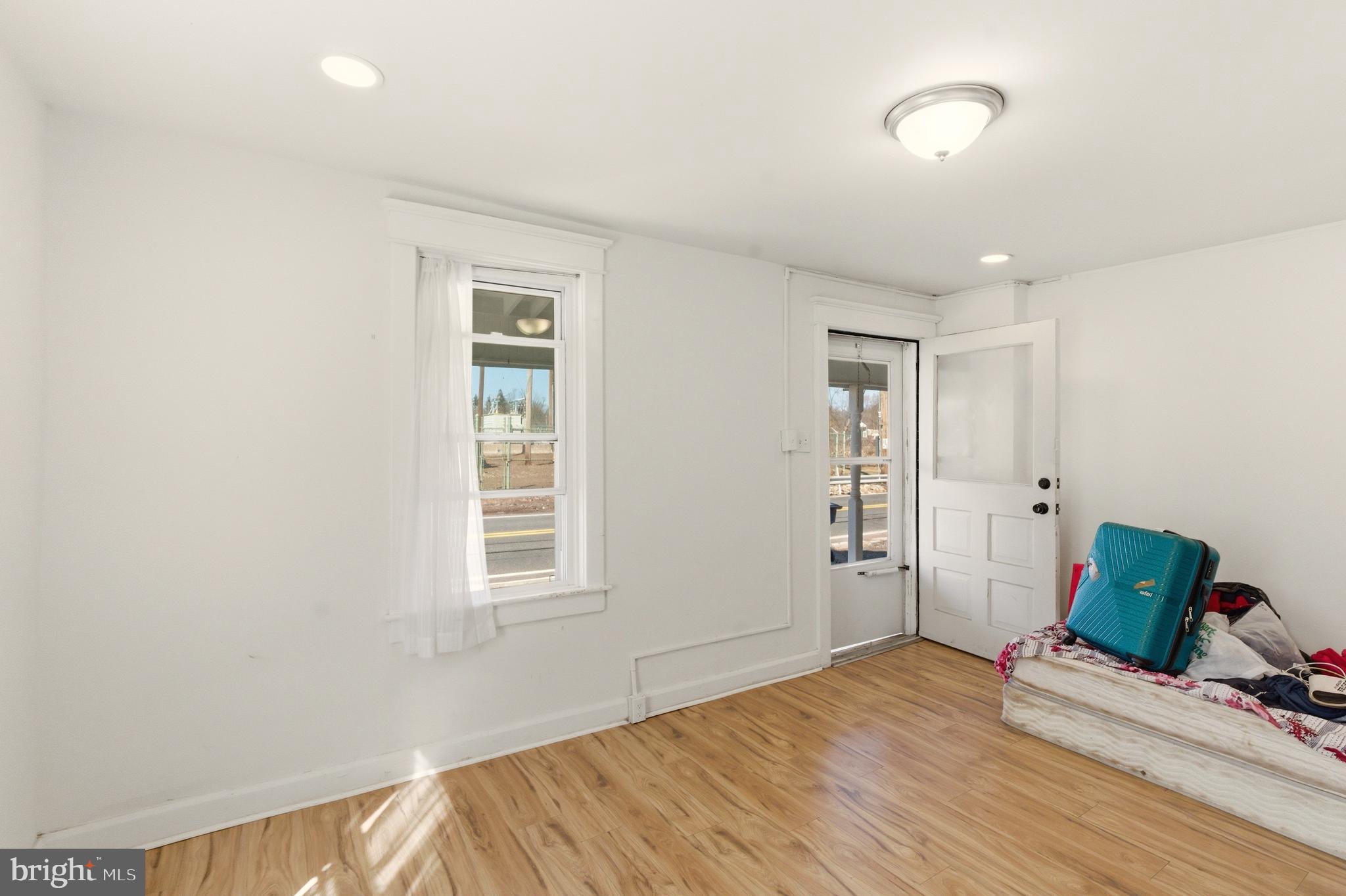 22-20 North Limerick Road Limerick, PA 19468 - Photo 22 of 49 a view of a livingroom with wooden floor and a window