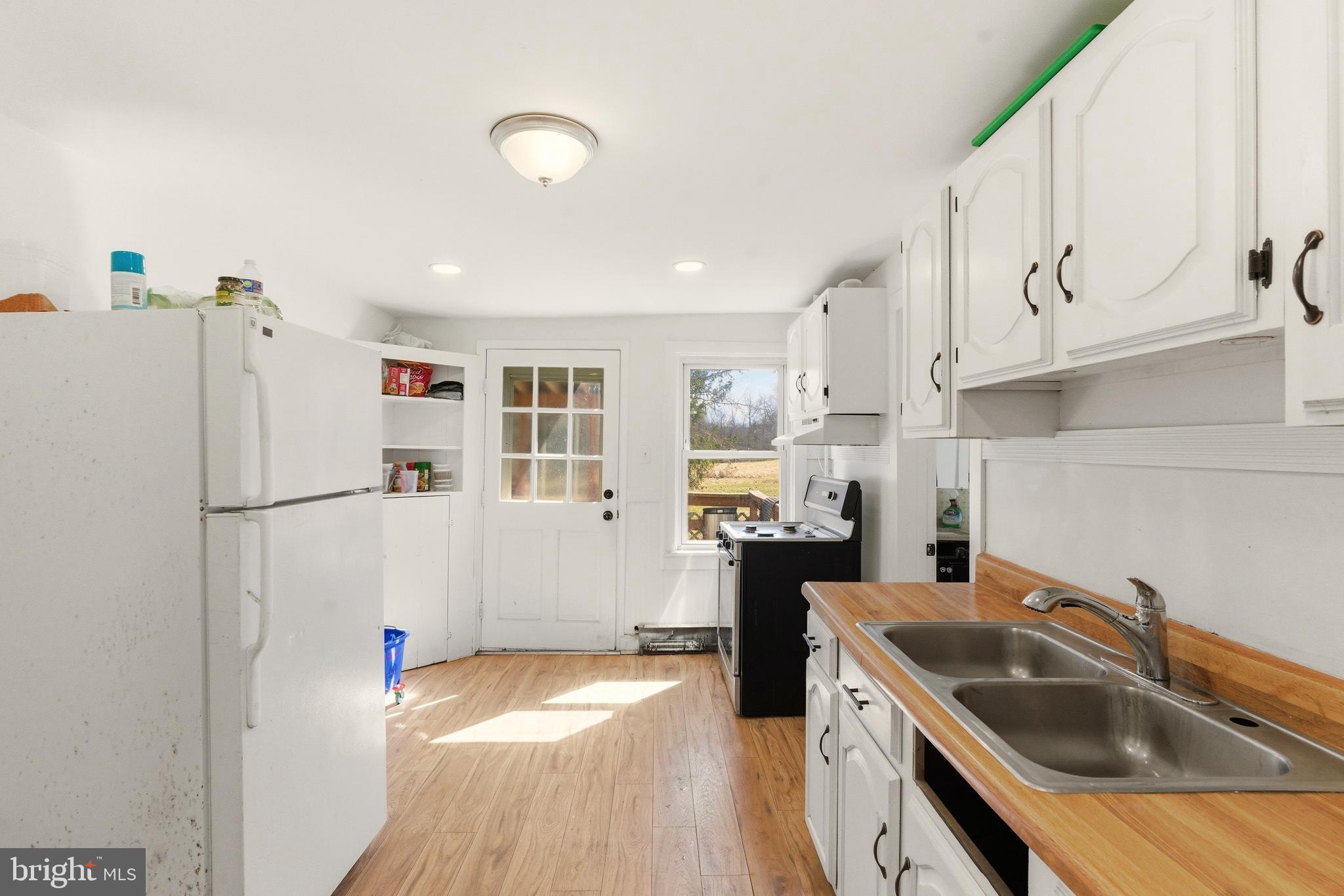 22-20 North Limerick Road Limerick, PA 19468 - Photo 26 of 49 a kitchen with a sink a refrigerator and cabinets