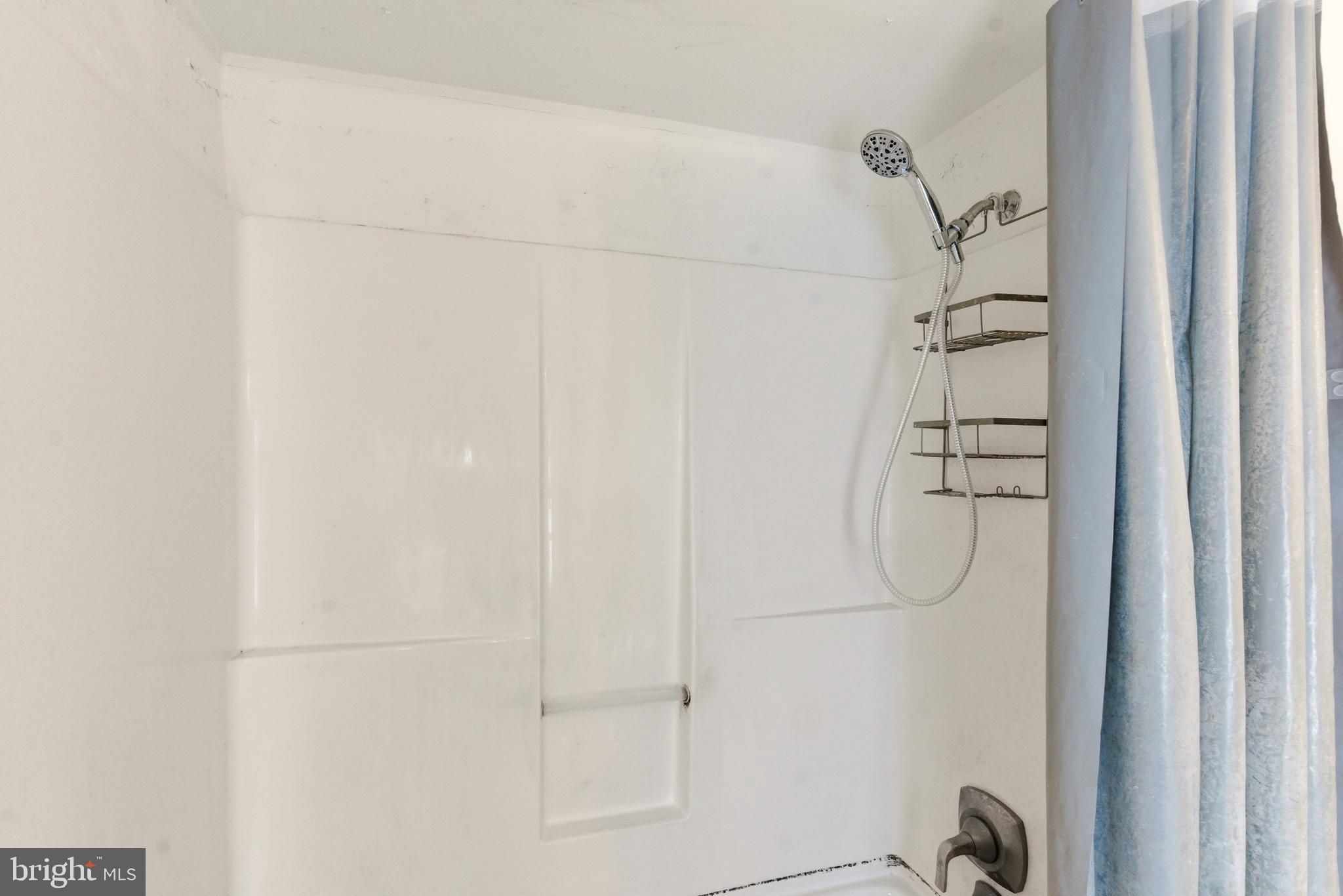 22-20 North Limerick Road Limerick, PA 19468 - Photo 32 of 49 a bathroom with a glass shower door