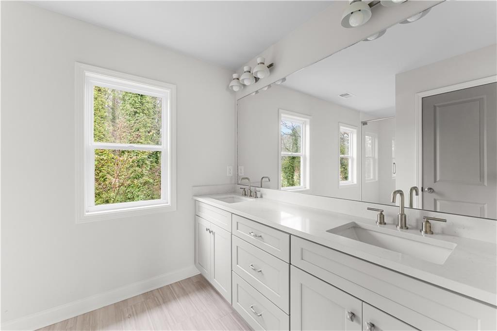 3804 Cottage Circle Clarkston, GA 30021 - Photo 5 of 9 a bathroom with 2 sink and a window