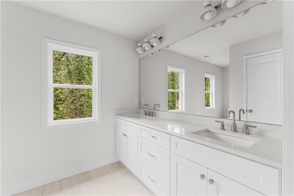 3804 Cottage Circle Clarkston, GA 30021 - Photo 6 of 9 a bathroom with 2 sink and a window