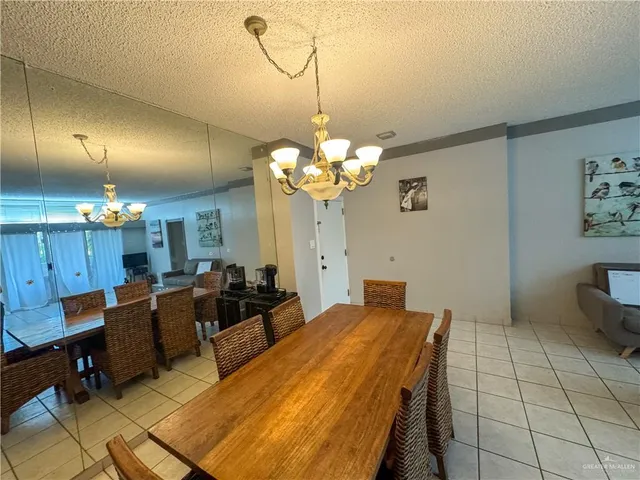 a bed room with a bed mirror and a night stand