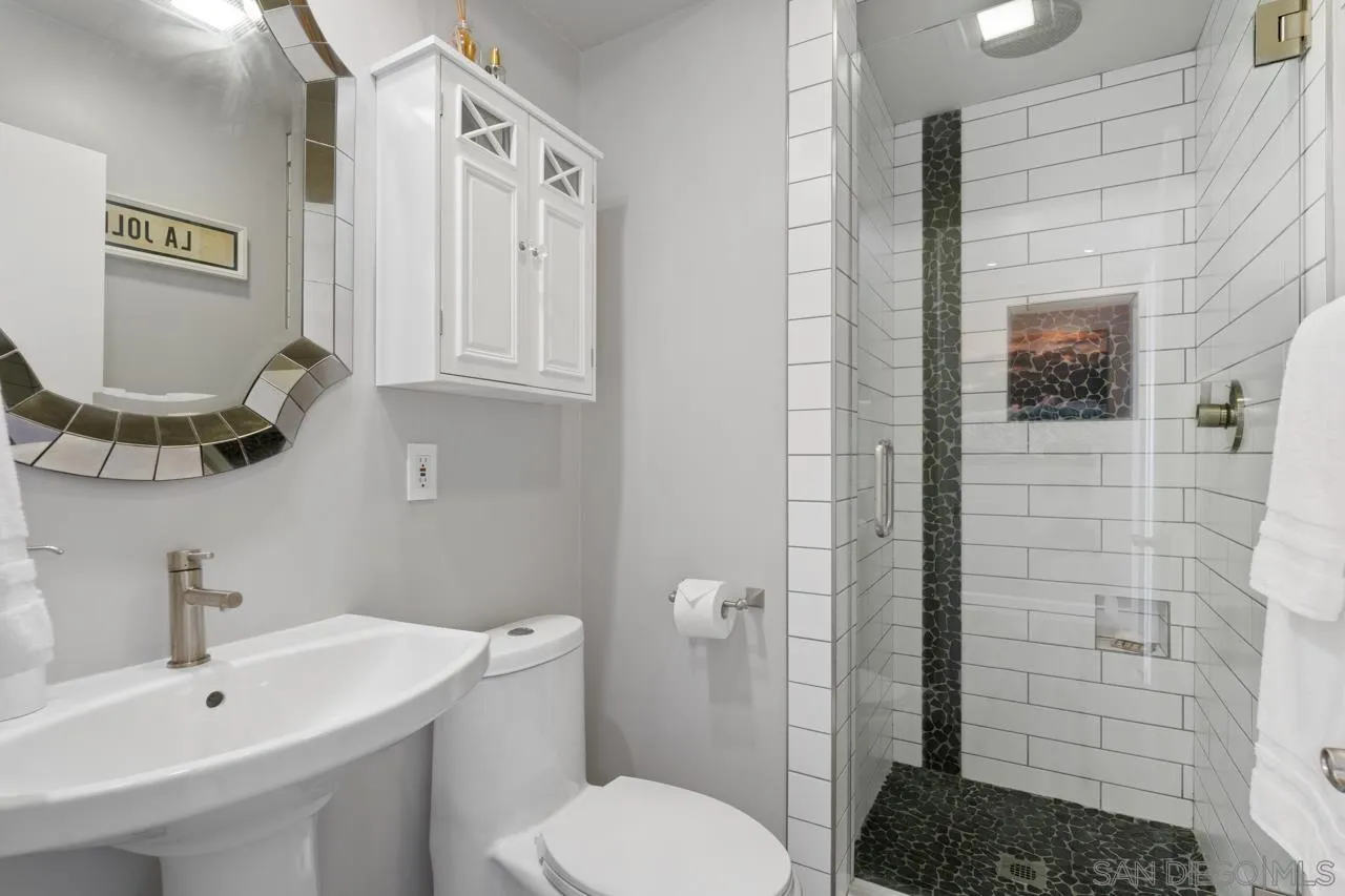 1219 Coast Boulevard, Unit 4 La Jolla, CA 92037 - Photo 16 of 16 a bathroom with a sink toilet and shower