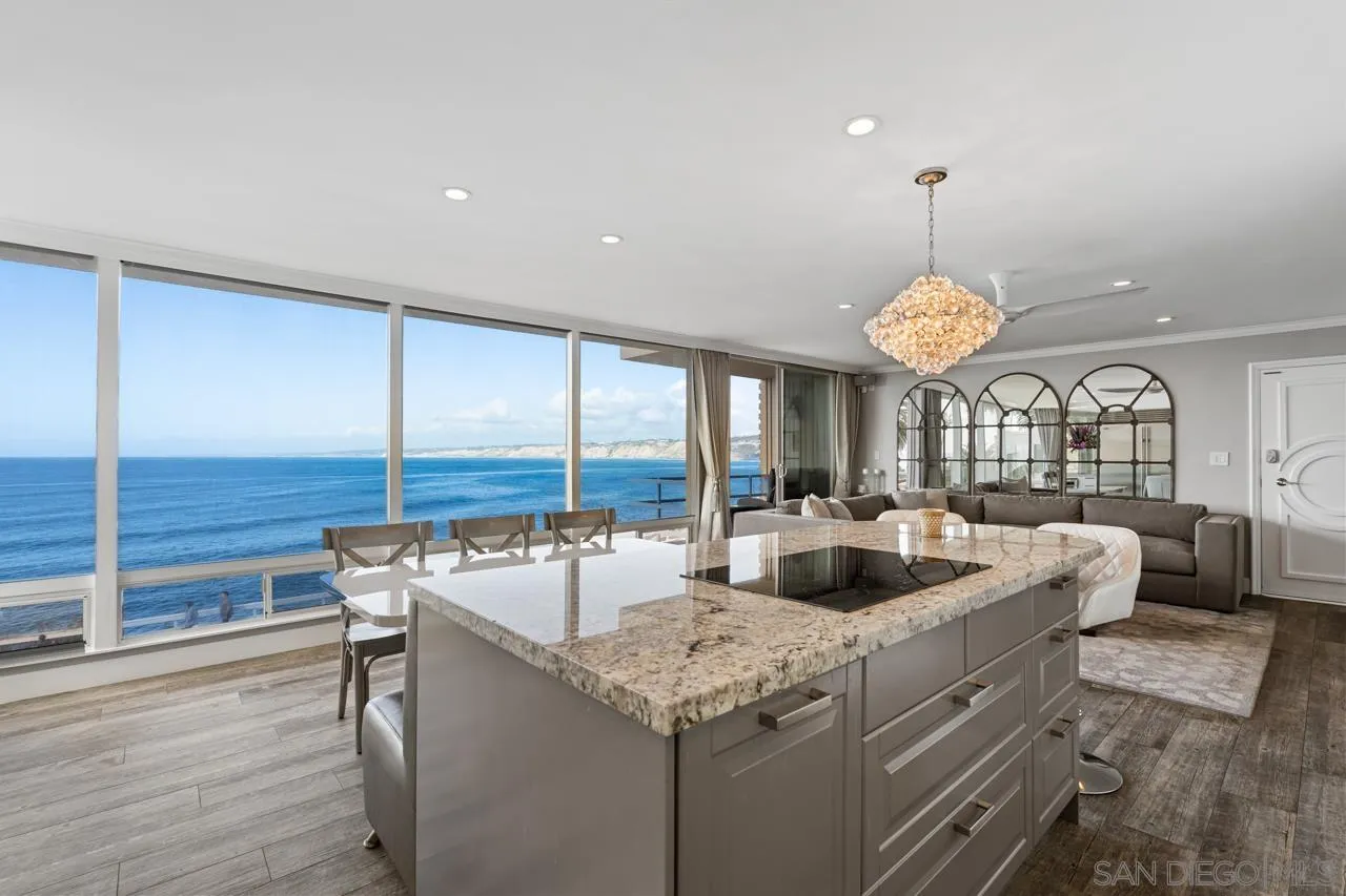 1219 Coast Boulevard, Unit 4 La Jolla, CA 92037 - Photo 4 of 16 a kitchen with a stove and a view of living room