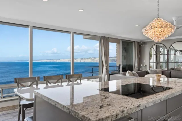 a view of a kitchen with granite countertop a sink and a counter top space