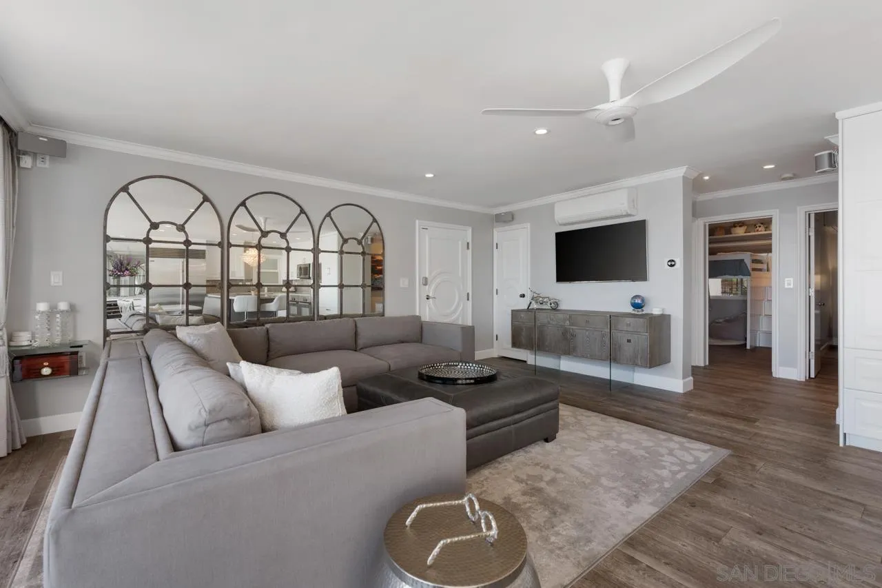 1219 Coast Boulevard, Unit 4 La Jolla, CA 92037 - Photo 7 of 16 a living room with furniture and a flat screen tv