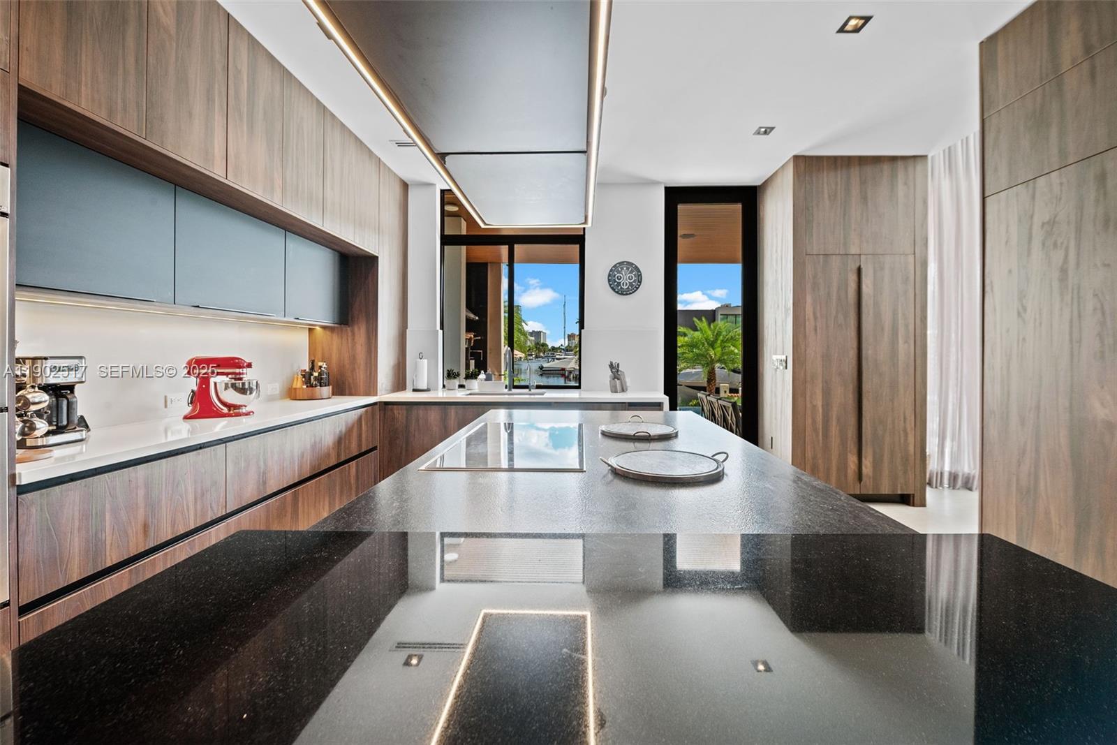 655 Layne Boulevard Hallandale Beach, FL 33009 - Photo 11 of 46 a kitchen with a sink and lots of counter space